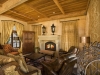 Villa Terra living room: Reclaimed ceiling beams - 4x6's cut from original 4x12 rough sawn beams reclaimed from San Jose's Town and Country Village in 2001. Several sources claim that the Town and Country Village was built in the 1950's using beams reclaimed from Sarah Winchester's barns. The Winchester Mystery House is located just across the street from T&C. Ceiling decking is the same reclaimed 1x4 from Notre Dame High School. Floor joists (not visible) above the ceiling are TJI's reclaimed from the movie set of Robin Williams' Millenium Man